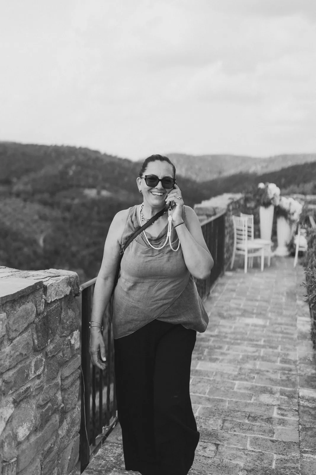 Simonetta Pollera coordinating suppliers on the phone on a wedding day in Italy