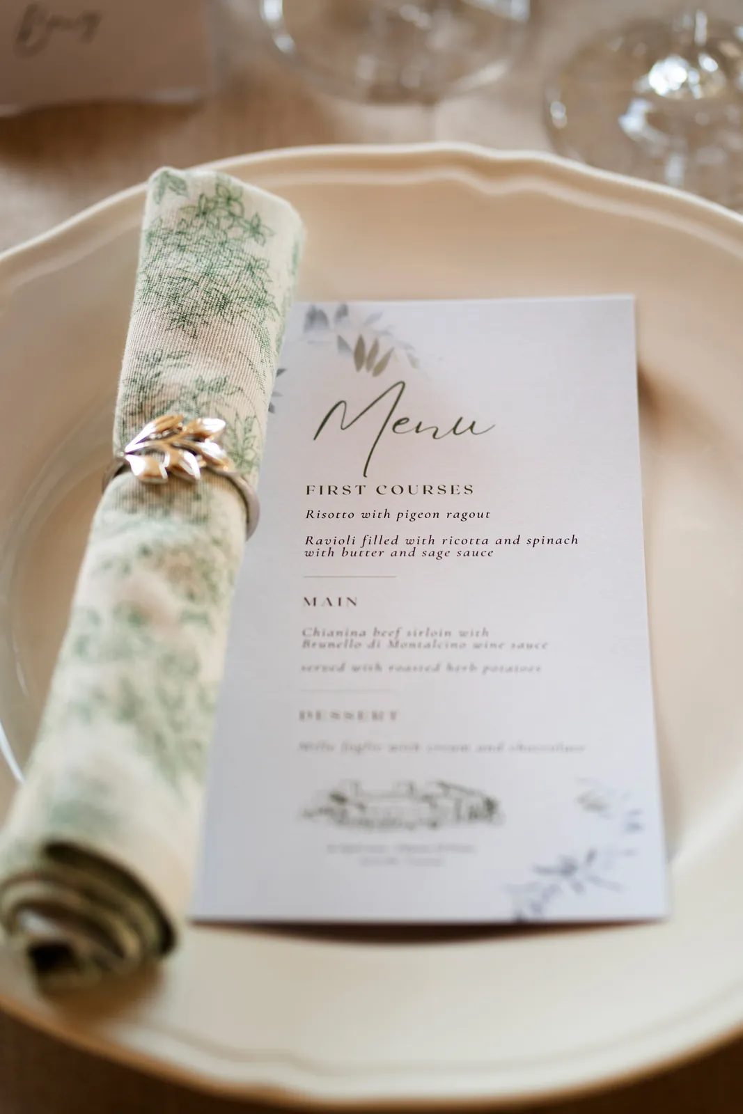 Wedding menu card on a plate with floral napkin, Italy